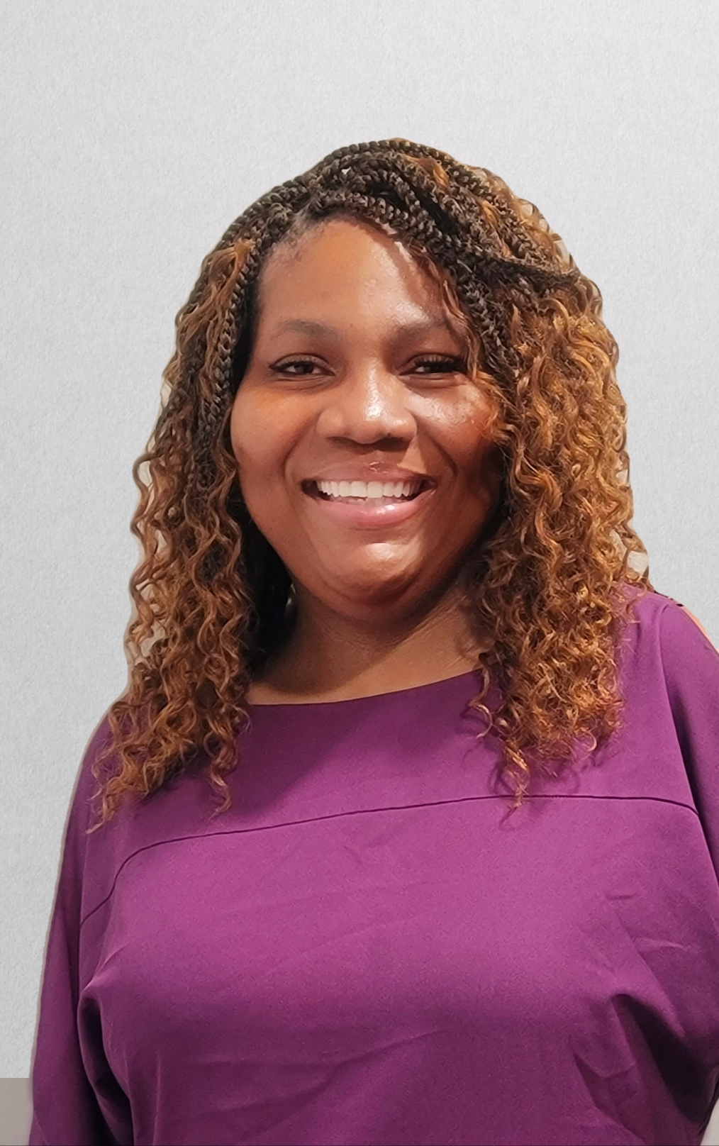 A person smiling for the cameraDescription automatically generated with low confidence